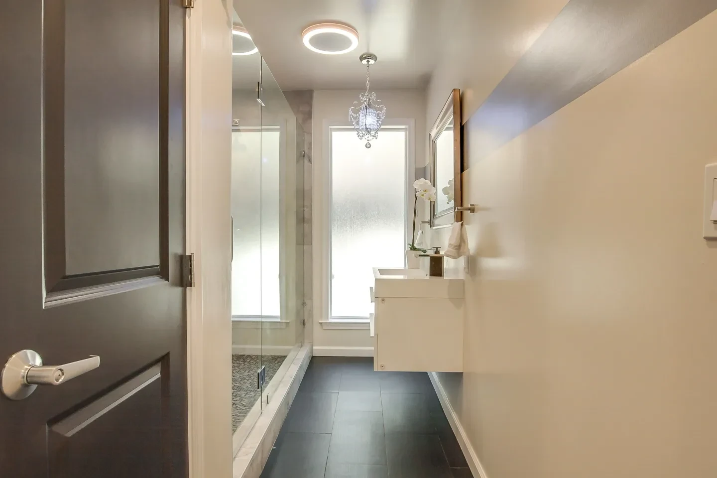 Modern spa-like bathroom with neutral tones and elegant fixtures